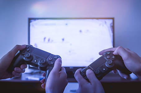 Two players playing video games on TV at home thumbnail