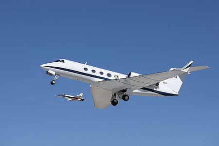 white and blue airplane at daytime thumbnail
