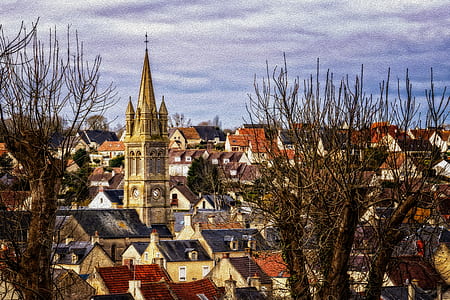clock tower surrounded by brown buildings thumbnail