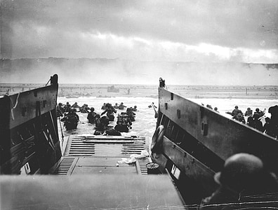 grayscale photography of soldier on beach thumbnail