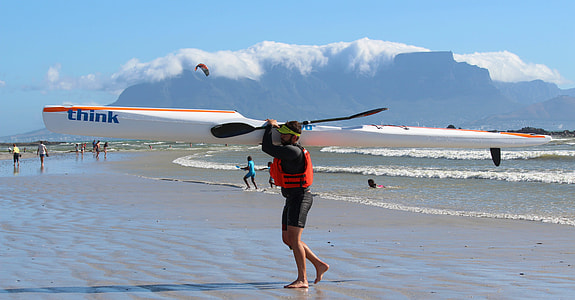 man carrying black boat paddle thumbnail