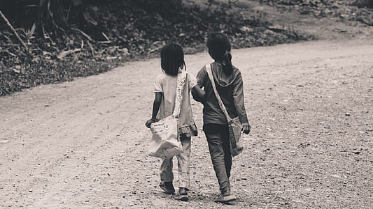 grayscale photography of two girls thumbnail