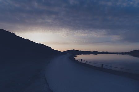 photo of road near body of water thumbnail