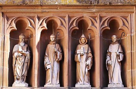 photo of four concrete statues thumbnail
