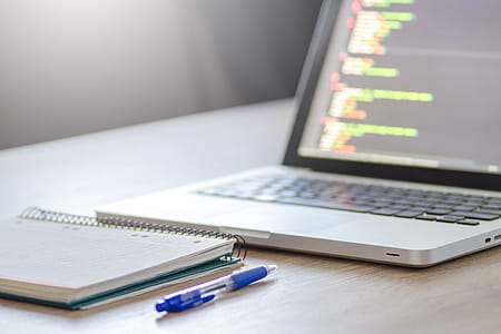 Coding on MacBook Laptop & Notepad thumbnail