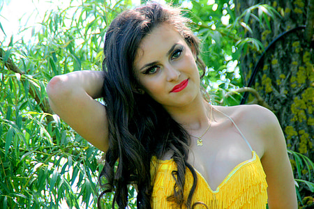 woman wearing yellow fringe bra thumbnail