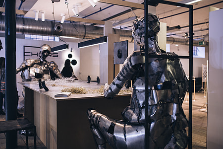Metal figures by a table full of metal shavings thumbnail