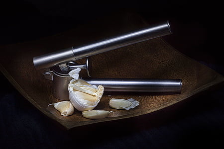 gray metal garlic slicer and garlic thumbnail