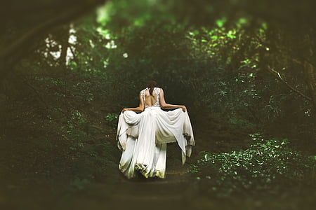 woman wearing white open-back sleeveless dress thumbnail
