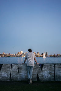 man standing near sea thumbnail