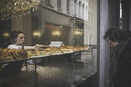 worker accommodating costumer during nighttime thumbnail