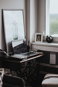 Workplace with a laptop and a notebook on a desk thumbnail