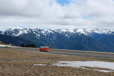 red bus on asphalt road thumbnail