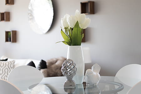 white tulips placed in white ceramic vase thumbnail