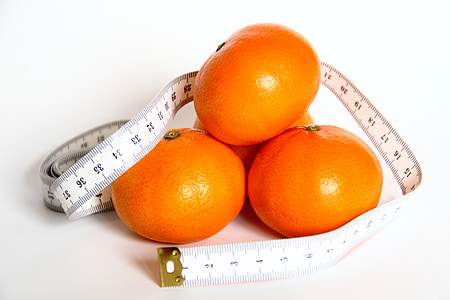 orange fruits wrap by white tape measure thumbnail