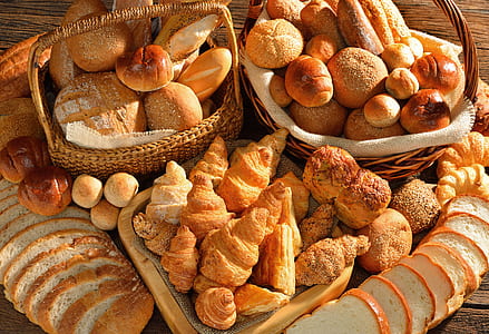baskets of baked breads on table thumbnail
