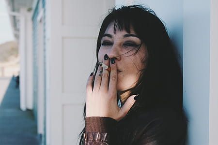 woman smoking holding cigarette filter thumbnail