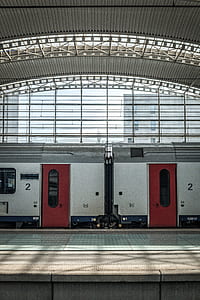 red and white train under dome thumbnail