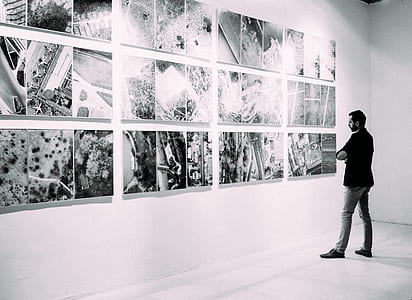 man looking at pictures thumbnail