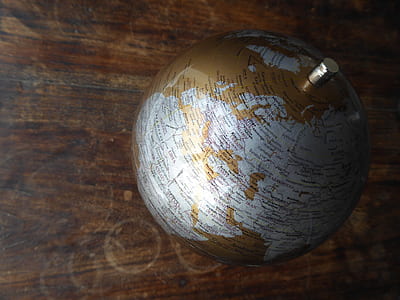 gray and brown desk globe on floor thumbnail