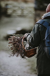 person carrying basket and bunch of flowers thumbnail