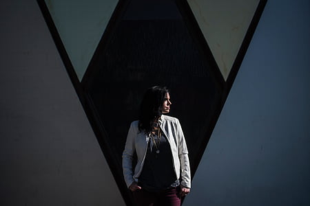 woman facing sideways with her hands on her pocket thumbnail