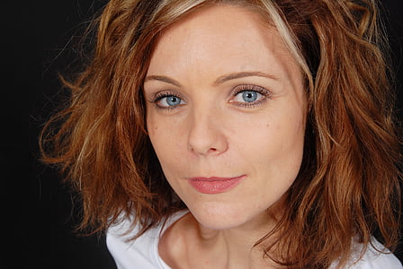 close up photo of woman wearing white top thumbnail