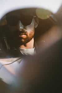 closeup photo of man's face wearing sunglasses thumbnail