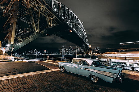 classic blue car arch bridge at nighttime thumbnail