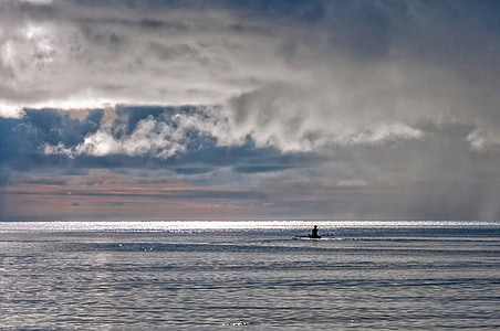 silhouette photo of person on canoe thumbnail