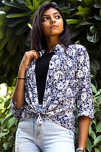 Woman In Blue And White Floral Top thumbnail