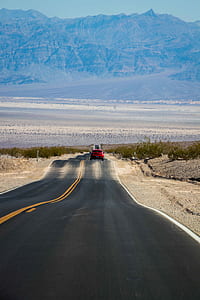 red car on gray concrete road thumbnail