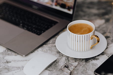 Coffee in a cup on a marble desk thumbnail