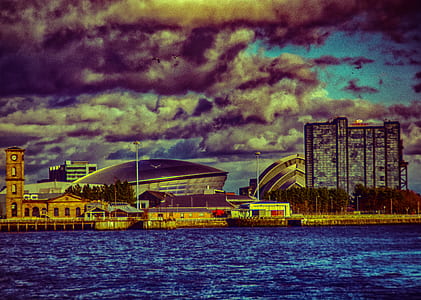 skyline photography under grey and blue sky thumbnail
