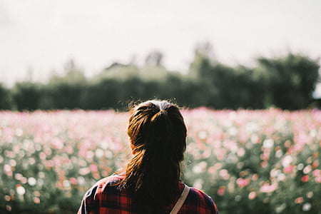 woman standing on flower garden thumbnail
