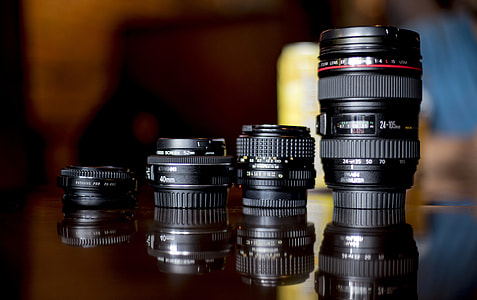 four black DSLR camera lens in shallow focus photography thumbnail