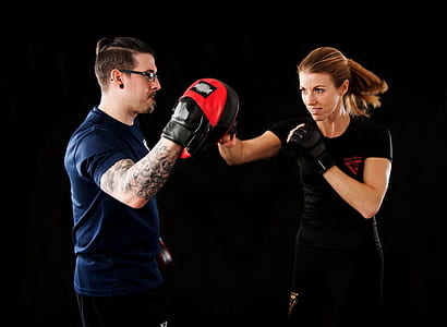 woman punching focus mitt thumbnail