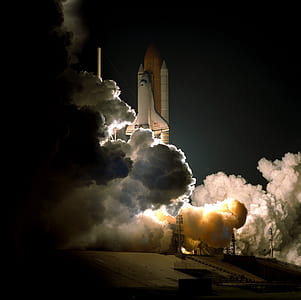 space shuttle at night time thumbnail