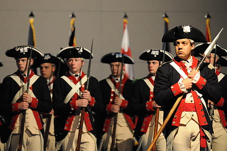 royal guards standing while holding rifles thumbnail