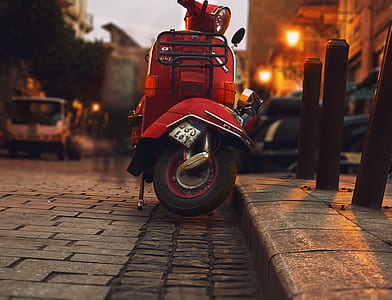 Selective Photography of Red Motor Scooter thumbnail