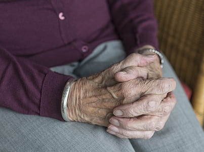 person wearing silver-colored bangle bracelet thumbnail