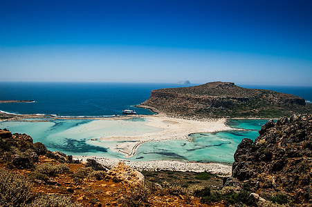 aerial photography of sea and mountain during daytime thumbnail