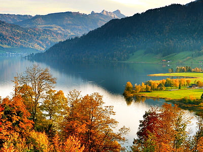 body of water beside mountains thumbnail
