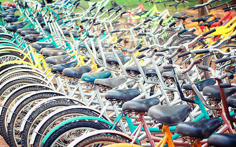 photo of assorted-color bike lot on brown ground at daytime thumbnail
