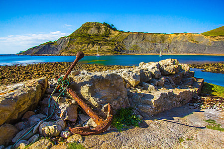 brown metal anchor near gray rock thumbnail