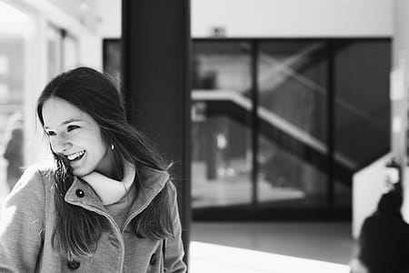 Woman in Gray Jacket Near Black Board thumbnail