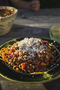 spaghetti served on plate placed on top of table thumbnail