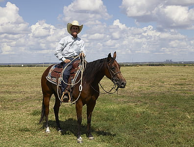 man riding on horse thumbnail