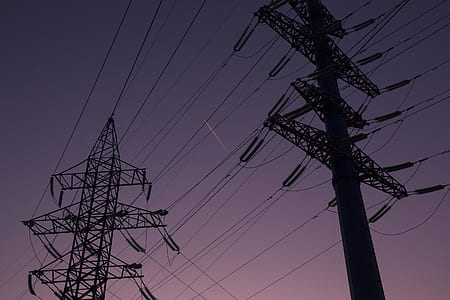 silhouette photo of electric pylon thumbnail