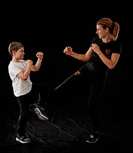 woman and boy performing martial arts thumbnail